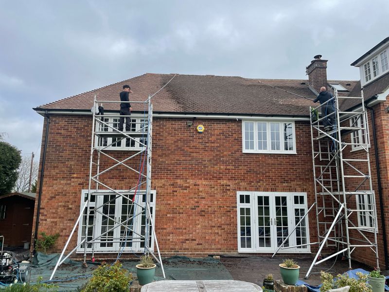 Roof cleaning carried out safely from scaffold towers by The Roof Moss Cleaners in Sonning Common